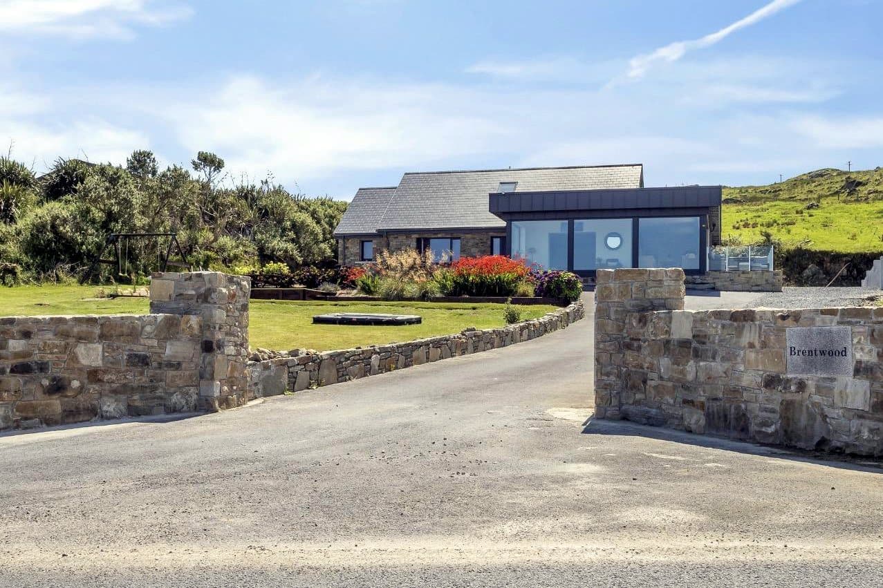 The renovated home in its coastal setting