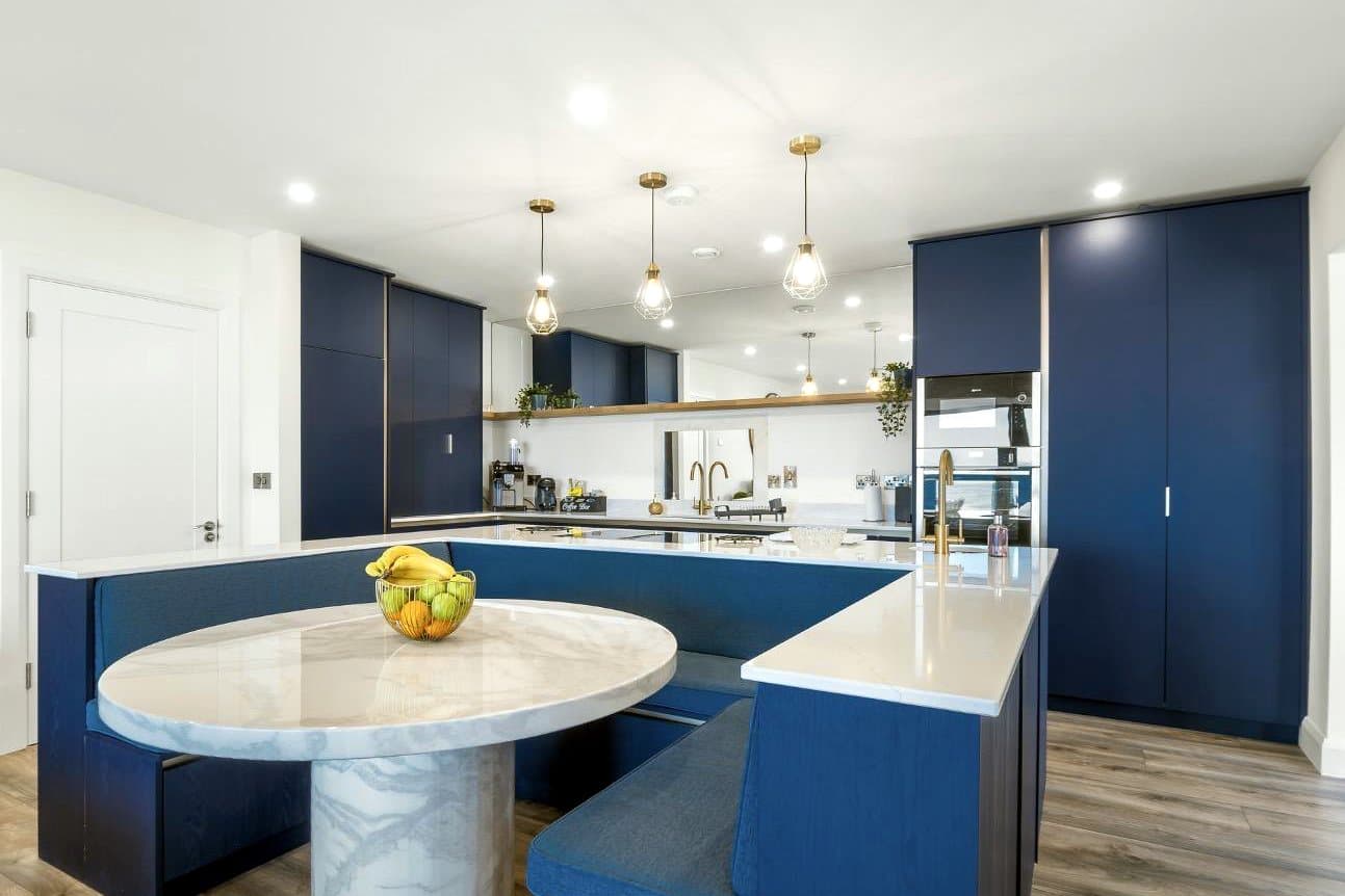 Bespoke navy kitchen with curved island