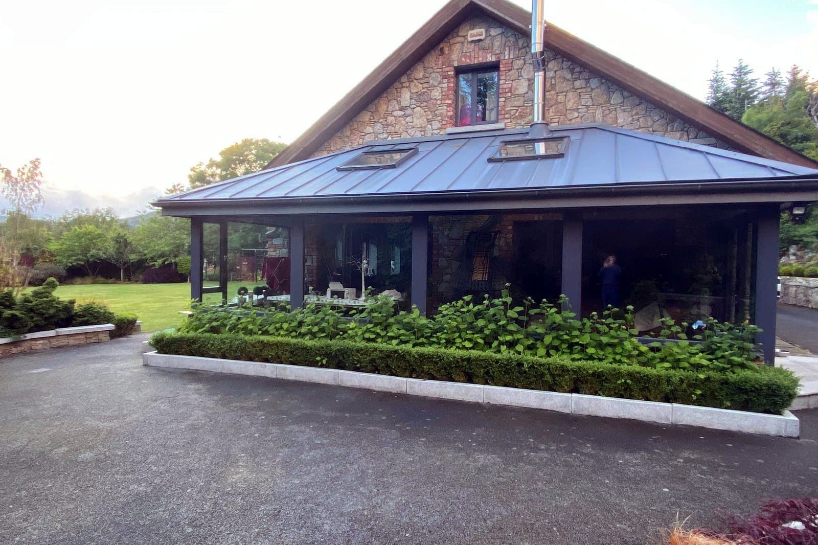 Renovated coastal home — front elevation with covered veranda