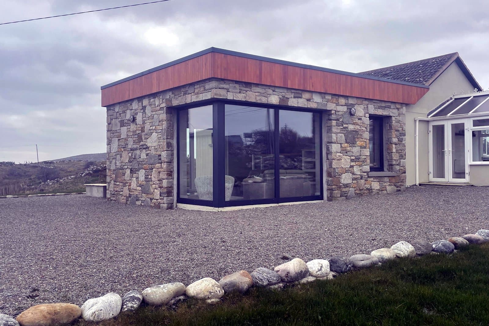 Natural stone and full-height glazing