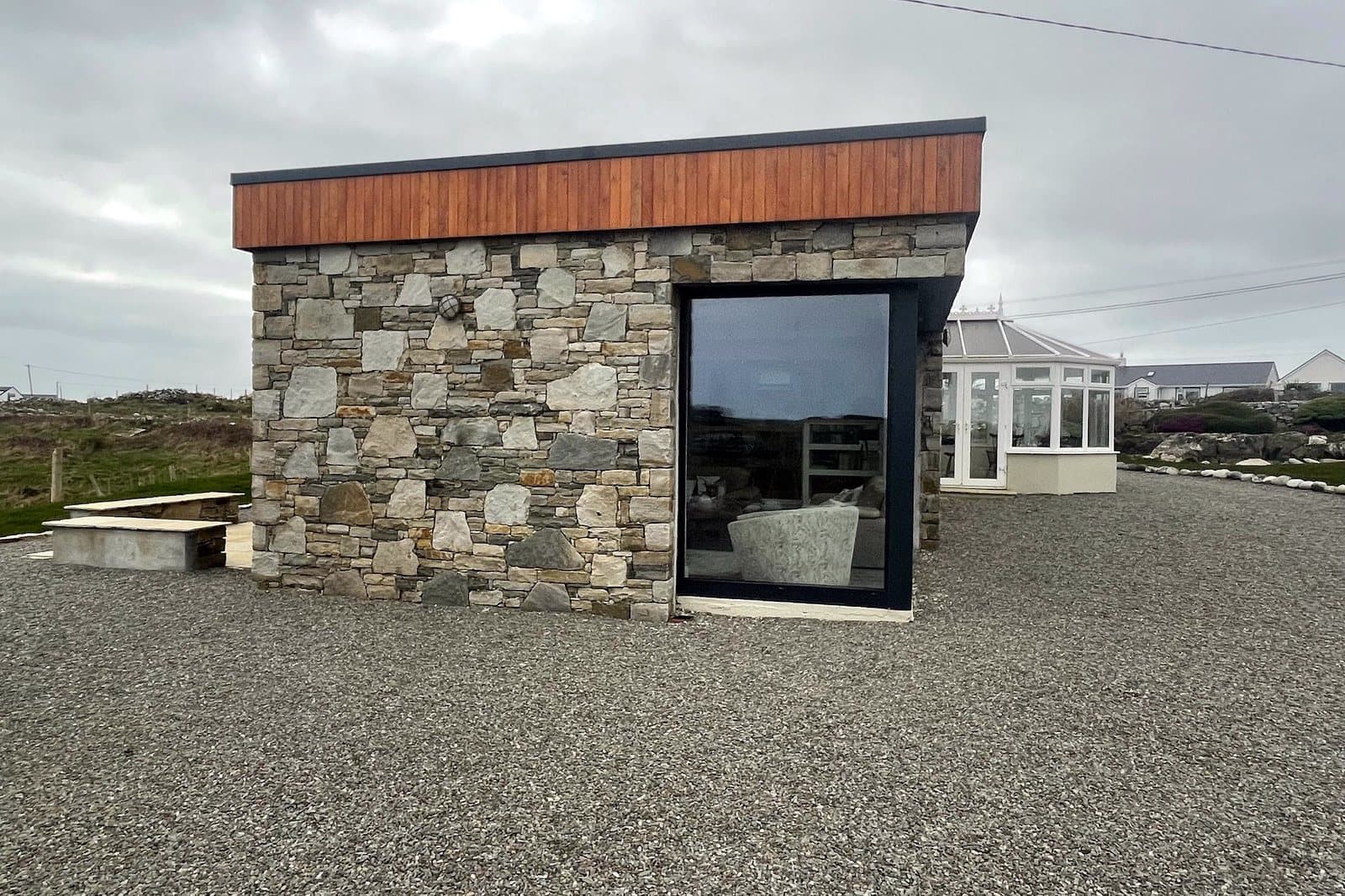 Stone entrance and contemporary doorway