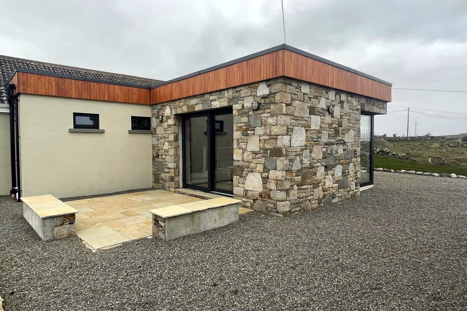 Stone and rendered extension — side elevation