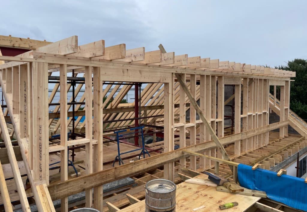 Timber frame extension stage tied into main structure